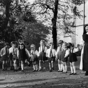 Sister David Power with her pupils at Holly Mount Convent at Tottington, near Bury, Lanes