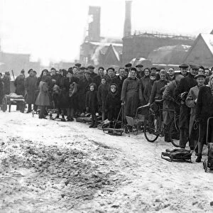 With sledges, prams and barrows a daily queue forms at the Redheugh Gasworks for coke