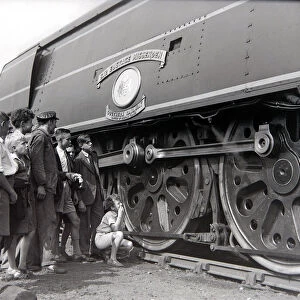 Small boys admire the Battle of Britain class steam locomotive during an open day at
