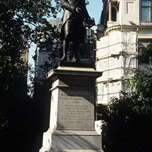 Statue of Robert Raikes in Embankment gardens London