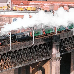 Steam locomotive 44767 George Stephenson leaves Newcastle over the Kinge George Bridge