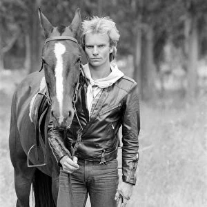 Sting, from the pop / rock group The Police. Pictured here with a horse