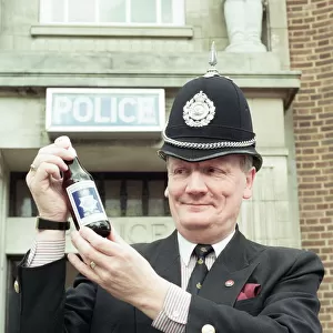 Supt Roger Bagley of Dudley Police with a bottle of "Bobby Bitter s"