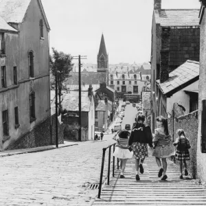 Swansea. Where cobbles are yet to giveaway to modern flagstones these four happy