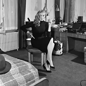 Swedish actress, Anita Ekberg, pictured in her hotel room at The Savoy, London