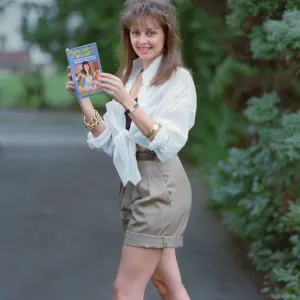 Television Presenter Carol Vorderman posing with her book Dirty