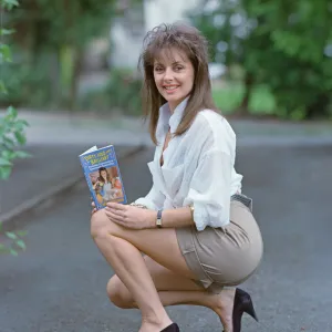 Television Presenter Carol Vorderman posing with her book Dirty