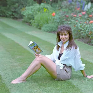 Television Presenter Carol Vorderman posing with her book Dirty