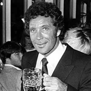 Tom Jones enjoys a pint at the Celtic Manor Hotel, Newport. 11th September 1983