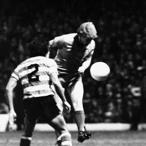 Tommy Burns footballer Celtic FC in UEFA Cup match heading the ball football strip