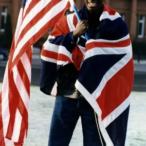 Tony Jarrett athlete runner with American and British flags at Kelvin Hall Glasgow