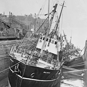 The trawler Magnolia seen here at lowtide at the entrance to St Andrews Dock
