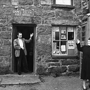 Tryweryn Valley - Mr Jones Parry, the postmaster, outside his post office at Capel Celyn