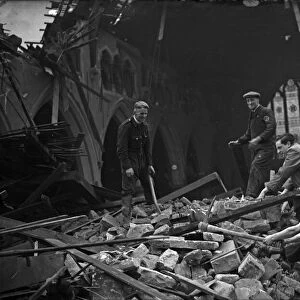 The vicar and parishioners search through the rubble and wreckage of St Clements