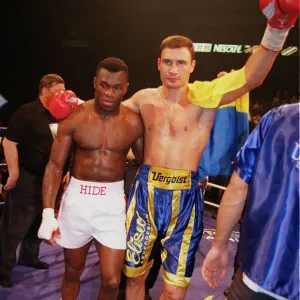 Vitali klitschko with arm around Herbie Hide after knocking him out in two rounds to take