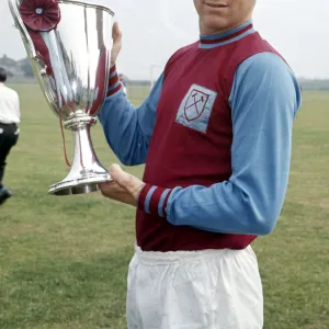 West Ham United captain Bobby Moore holds the European Cup Winners Cup trophy