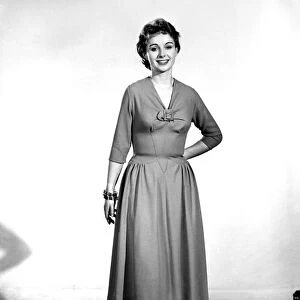 Woman wearing summer dress. Circa 1955