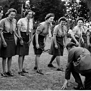 WW2 - June 1945 Competitors in Ladies Race at ATS sports meeting get instruction
