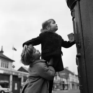 Two four year olds making sure that Father Christmas gets that letter in time