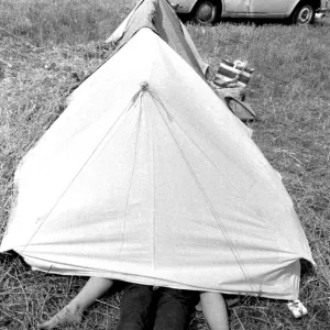 Young couple making love inside their tent at the Isle of Wight Pop Festival 30th