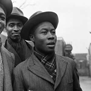Young West Indian men standing outside the Brixton Labour Exchange looking for employment