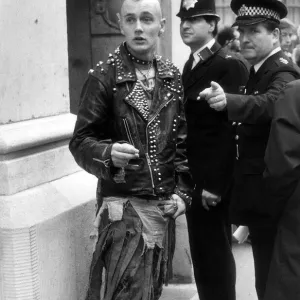 Youth Punks September 1984 Policemen tells punks where to go outside the Bank of