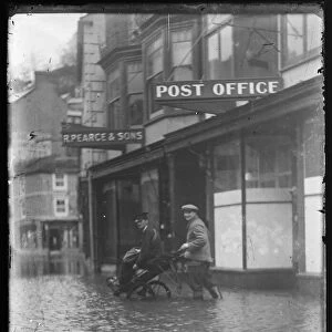 Fore St, East Looe, Postman helped in floodwater