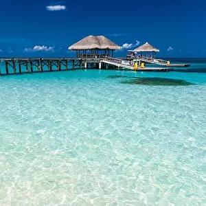 Amazing beach in Maldives with luxury water villas. Exotic background concept