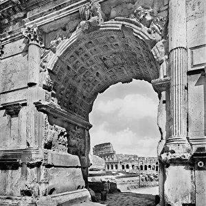 Detail of the barrel-vault of the Arch of Tito, across from which the Colusseum is visible. Roman Forum, Rome