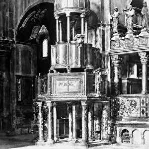 The double ambo next to the left pillar of the presbytery in St. Mark's Basilica in Venice