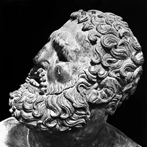 Detail of the face of the Pugilist at rest, bronze statue from the Augustan period, found in the baths of Constantine, Rome, and now located at the National Roman Museum (former Collegio Massimo)