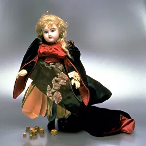 Good Luck doll in original fortune teller attire, made in France at the end of the Nineteenth century. Numerous pieces of paper with predictions for the future are sewn under the full skirt