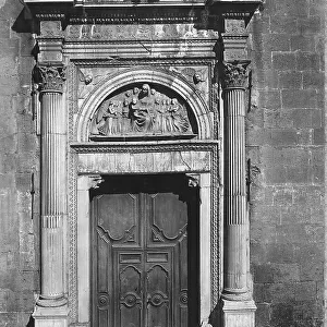 Portal of the Church of Saint Barbara in Naples. The doorway frames a lunette with the Madonna and angels by Andrea dell'Aquila
