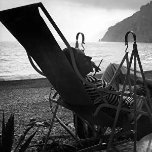 Portrait of the poet Sandro Penna (1906-1977) on a deckchair by the sea
