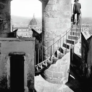 Staircase of the tower of Arnolfo in Palazzo Vecchio and view of the Cathedral, Florence