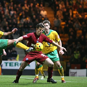 Paul Reid shields the ball at Norwich City