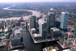 Prints of CANARY WHARF, Docklands, London. The towers of West India Dock with the River Thames beyond River Prints: Canary Wharf Print: Aerial View of London's Docklands