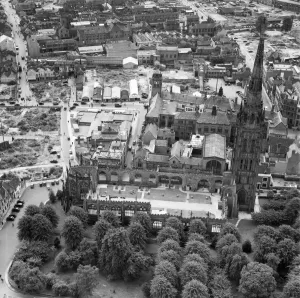 Prints of COVENTRY CATHEDRAL. The old Cathedral was destroyed by incendiary bombs on 14 November 1940, with only its spire and outer walls surviving Explore England - Iconic Landmarks and Places to Visit: Print of Coventry Cathedral from the air, July 1949
