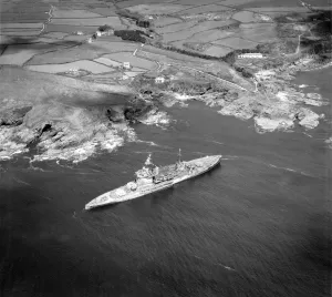 Prints of HMS WARSPITE, Prussia Cove, Cornwall. Warspite was launched in 1913 and saw action with the Royal Navy at the Battle of Jutland in 1916 Aerial Views of England - Landscapes, Cities and Heritage from Above: Print of HMS Warspite at Prussia Cove, Cornwall
