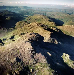 Prints of SCAFELL, Cumbria. Aerial photograph showing Scafell Pikes and the Lake District. Aerofilms Collection (see Links) Explore England - Iconic Landmarks and Places to Visit: Scafell Pikes Print, Aerial View of the Lake District Landscape