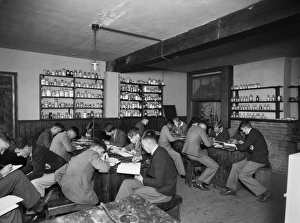<b class=qtipBold><figcaption>Bembridge School CC46_00164</figcaption></b><br>Bembridge School, Hillway Road, Bembridge, Isle Of Wight. Students working at desks in a chemistry classroom. There are shelves containing a variety of bottles on the walls and a fume cabinet in the corner. Photographed by Marshall Keene and Company between 1933 and 1939.<br><em>© Historic England Archive</em> Bembridge School CC46_00164
