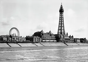 <b class=qtipBold><figcaption>Blackpool around 1900 OP00480</figcaption></b><br>BLACKPOOL, Lancashire. A view looking south-east from the North Pier towards Blackpool Tower with the Big Wheel visible in the background. The tower was built in 1891-4 by Maxwell and Tuke and was based on the design of the Eiffel Tower in Paris. Photographed between 1894 and 1910 by W and Co.<br><em>© Historic England</em> Blackpool around 1900 OP00480