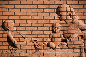 Brick relief of mother and children DP035286 Brick relief of mother and children DP035286
