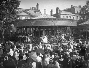 <b class=qtipBold><figcaption>Carousel ride CC49_00528</figcaption></b><br>St Giles Fair, Oxford. A crowd of people gathered around a carousel ride in St Giles during the annual fair, held at the beginning of September. Photographed by Henry Taunt in 1895.<br><em>© Historic England</em> Carousel ride CC49_00528