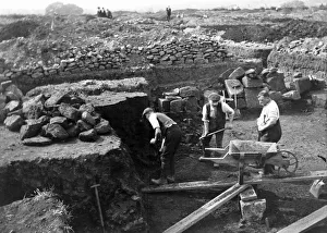 <b class=qtipBold><figcaption>Corbridge Excavations FL00667_02_002</figcaption></b><br>Corbridge Roman Fort, Corbridge, Northumberland. Excavations in progress in 1909 showing three men digging.<br><em>© Historic England Archive</em> Corbridge Excavations FL00667_02_002