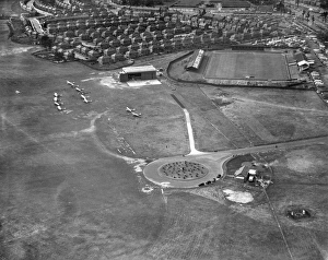 <b class=qtipBold><figcaption>Doncaster Airport EPW049428</figcaption></b><br>DONCASTER AIRPORT AND BELLE VUE STADIUM. View of the airfield and the home of Doncaster Rovers Football Club, photographed in 1935. Aerofilms Collection (see Links).<br><em>© Historic England</em> Doncaster Airport EPW049428