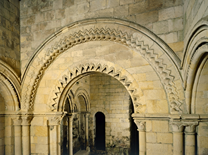 <b class=qtipBold><figcaption>Dover Castle J870618</figcaption></b><br>DOVER CASTLE, Kent. Interior view of the lower chapel. The round-headed archway with chevron ornament.<br><em>© Historic England</em> Dover Castle J870618