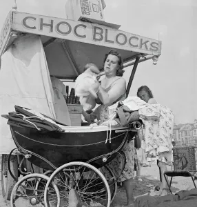 Prints of Blackpool, Lancashire. A young mother with baby and pram standing beside an ice cream cart. Photographed by John Gay 1946-55 Then and Now England - Historic Change Over Time: Blackpool Mother with Baby and Ice Cream Cart Print