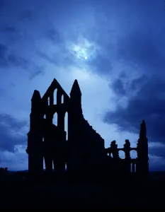 Prints of WHITBY ABBEY, North Yorkshire. Atmospheric silhouette of the ruins on a full moonlit night Historic Landmark Prints: Whitby Abbey Print: Moonlit Ruins Silhouette