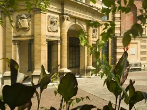 Prints of ELTHAM PALACE, Greenwich, London. A view of the loggia through foliage Palace Prints: Eltham Palace Print: Loggia through Foliage